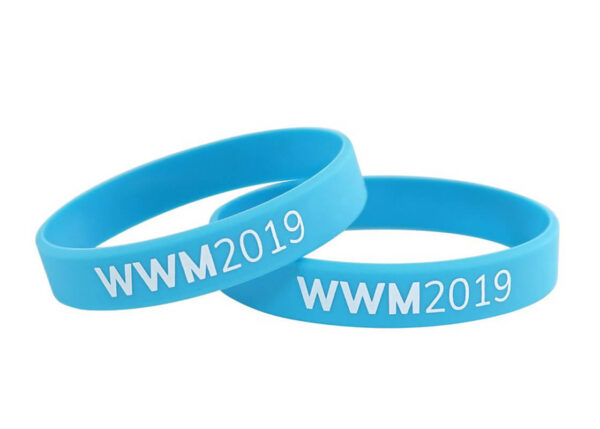Set of blue silicone wristbands with white printed logo and event branding.