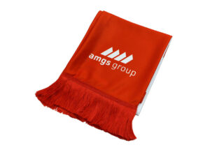Red branded AMGS Group scarf with white logo and tassels, shown in close-up.