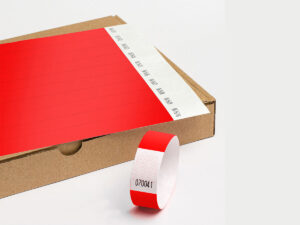 Red Tyvek wristbands supplied in sheets. Tear-resistant, hypoallergenic material by DuPont. Manufacturer AMGS Group.