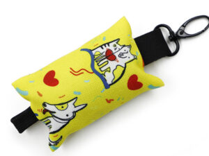 Detailed view of a colorful, customizable dog poop bag holder with fun cat patterns and a durable carabiner hook.