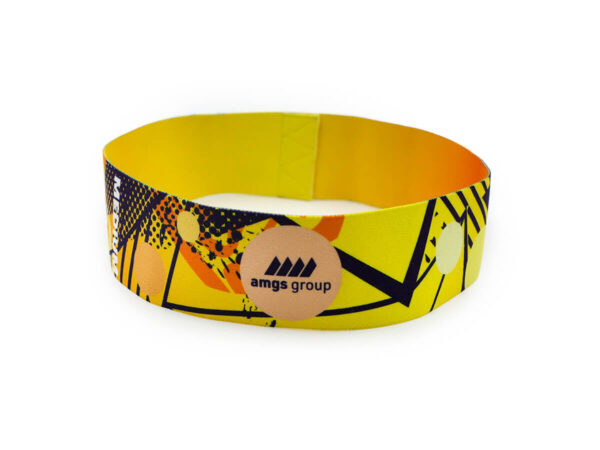 Yellow sublimated fitness resistance band with AMGS GROUP logo and medium tension level.