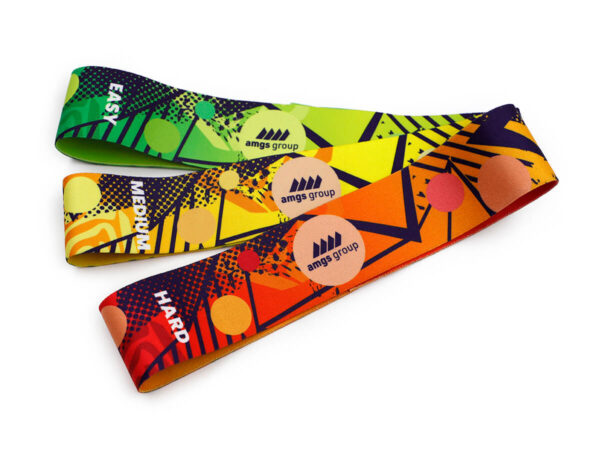 Set of three custom resistance bands in green, yellow, and orange with different tension levels and sublimated AMGS GROUP branding.