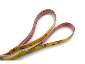 Custom dog leash in yellow and pink with heart and cat graphics, featuring a secure loop handle.