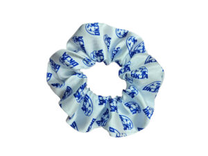 AMGS Group branded satin scrunchie with blue all-over logo on white — retail giveaway and beauty launch; contact us to discuss your project.