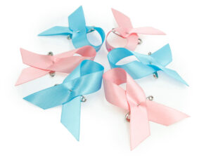 Set of pink and blue satin awareness ribbon pins with safety pins, manufacturer AMGS Group.