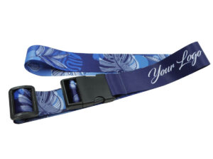 Close-up of a sublimation-printed luggage strap showing a dark blue section for branding and a contrasting tropical design.